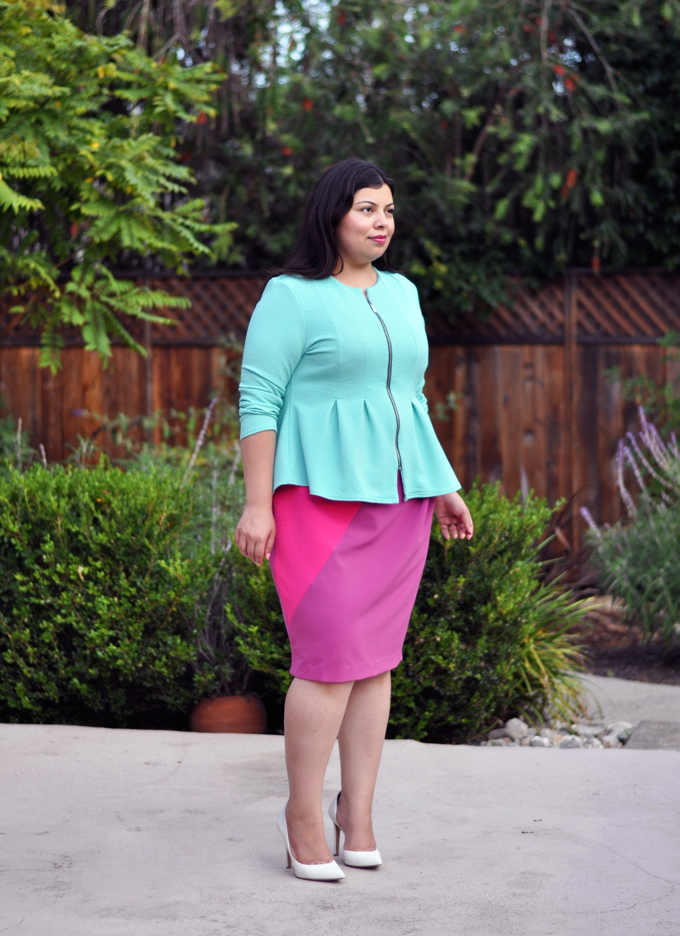 Plus size blogger Jay Miranda wearing pink sheath dress and mint jacket