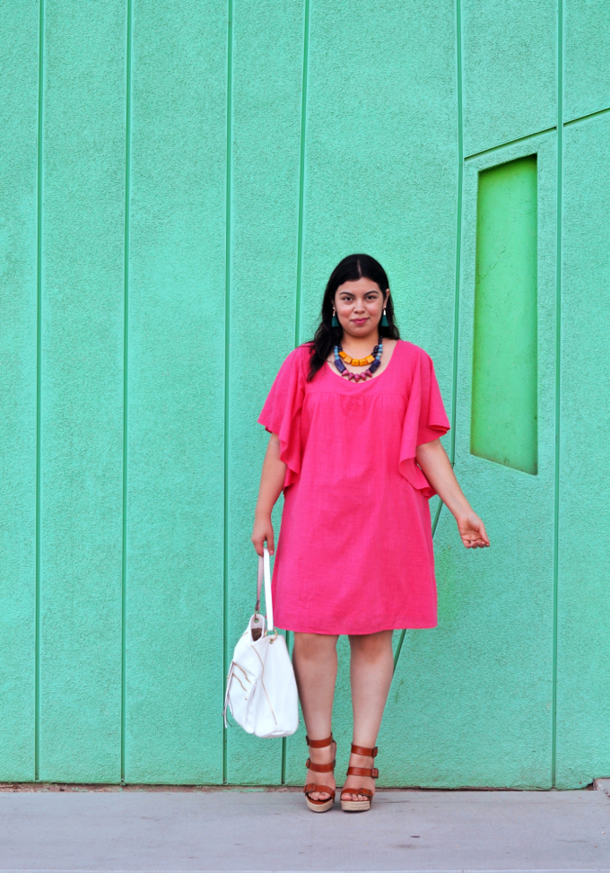 Pink plus size dress worn by blogger Jay Miranda